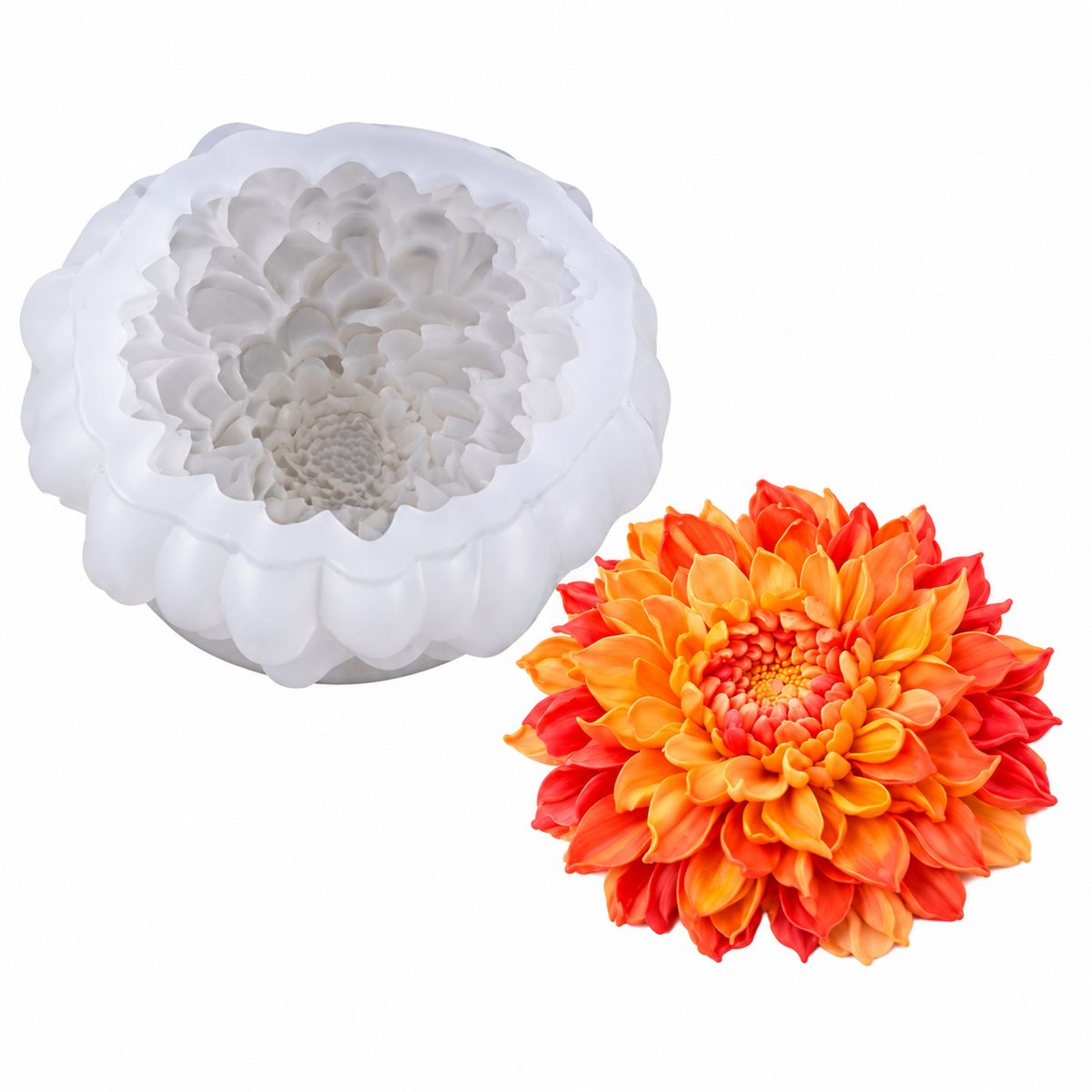 A white silicone mold with a dahlia flower design shown next to a vibrant orange and red artificial dahlia flower on a plain white background.