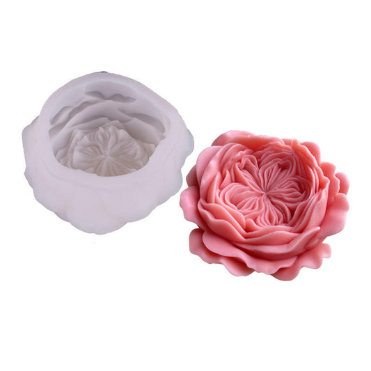 A silicone mold for crafting, shown empty in translucent white on the left and filled with a pink 3D rose on the right, against a plain white background.