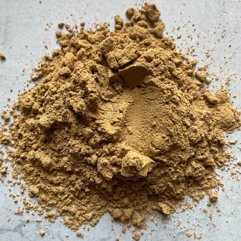A close-up image of Bentonite Clay, showing the fine, powdery texture of the clay.