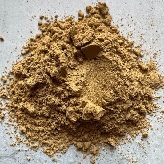 A close-up image of Bentonite Clay, showing the fine, powdery texture of the clay.