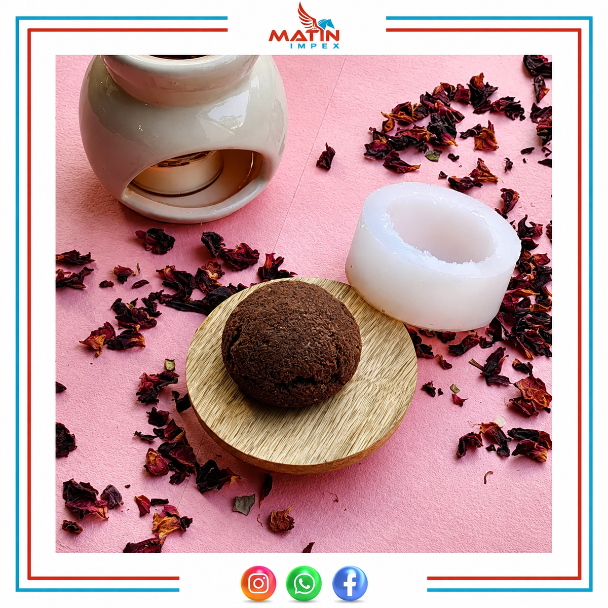 A white silicone wax melt mold shown next to a dark brown wax melt on a small wooden dish, with a ceramic warmer in the background on a pink surface scattered with dried red flower petals. The brand logo 'MATIN IMPEX' is visible at the top.