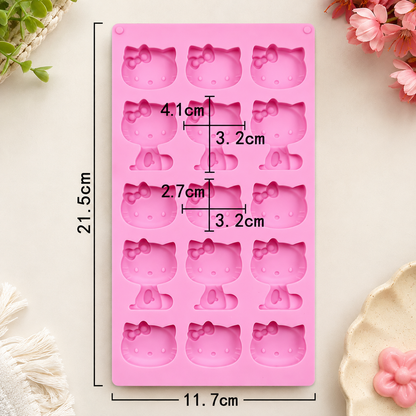 Pink silicone mold with Hello Kitty face cavities, shown with printed dimensions (21.5 cm tall, 11.