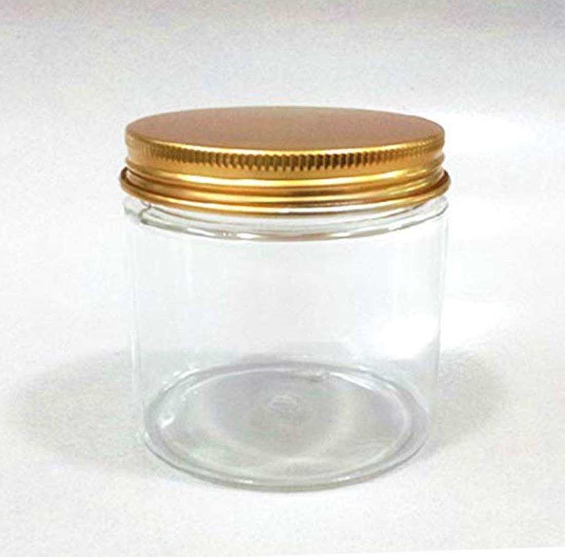 Clear glass jar with a gold metal lid on a white background