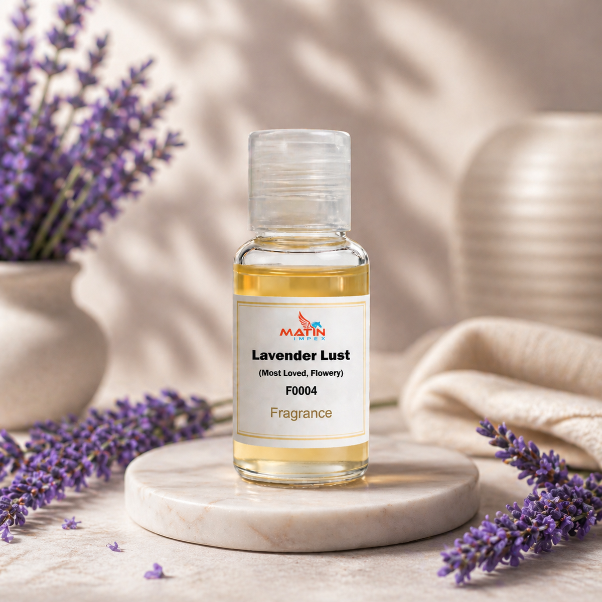 Bottle of Lavender Lust fragrance with lavender flowers on a neutral background