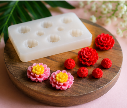 White silicone mold with floral designs on a wooden board