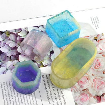 Colorful silicone ice cube trays on a floral-patterned surface