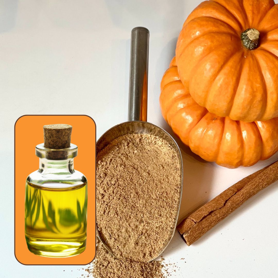 A collection of items including a small bottle with a cork stopper, possibly containing fragrance oil, a scoop with a powder inside, and a small pumpkin, with a cinnamon stick in the background.