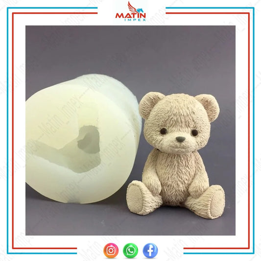 A silicone candle mold alongside a teddy bear-shaped candle made using the mold.
