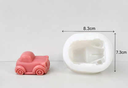 Pink car-shaped mold next to a white silicone mold with dimensions indicated.